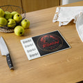 Ronin Crest Glass Cutting Board: glass cutting board with the RONIN crest and stacked $RONIN lettering