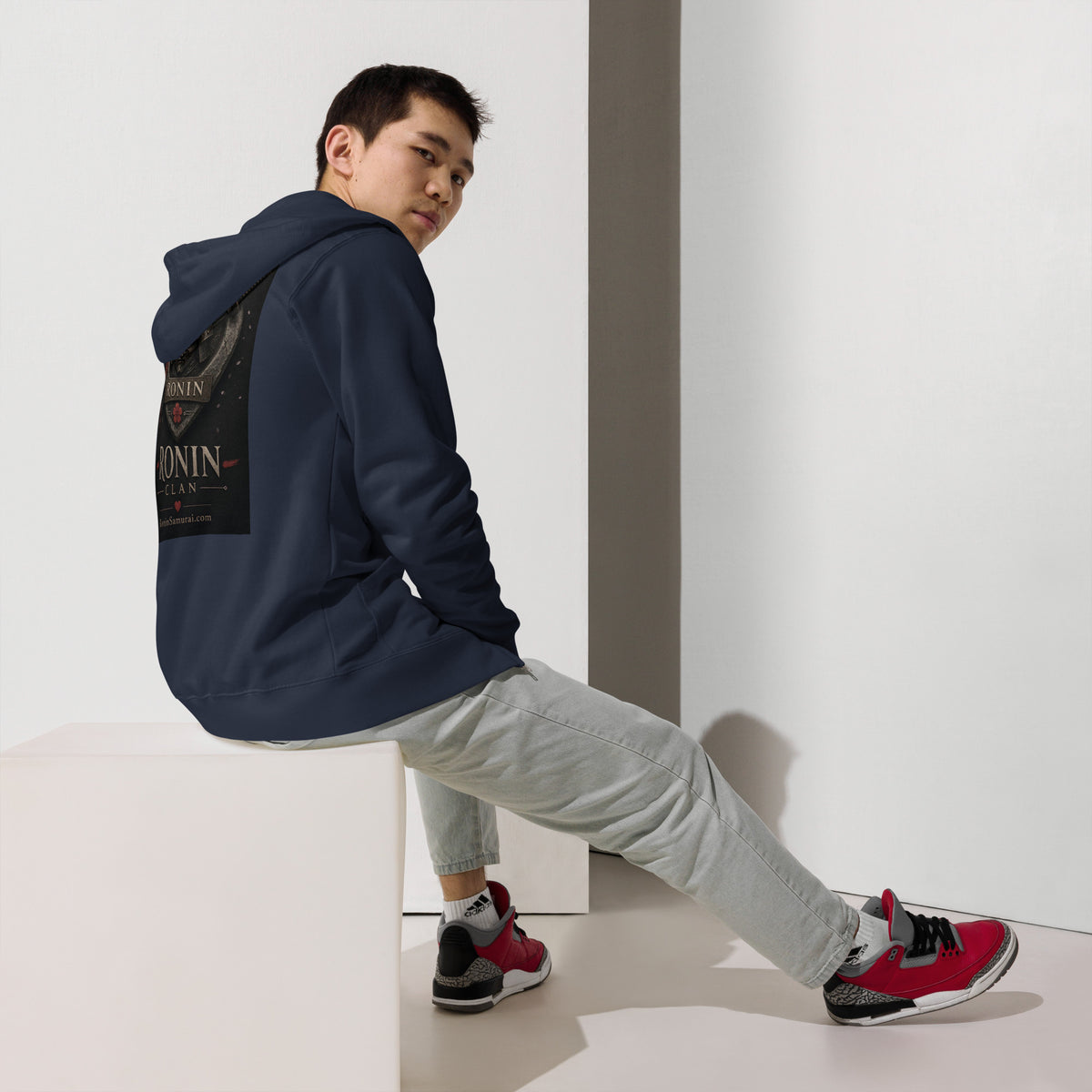 Royal Crest Ronin Clan Zip Hoodie, classic navy back: gilded red-and-gold heart shield with the 侍 seal, RONIN CLAN and kabuto emblem