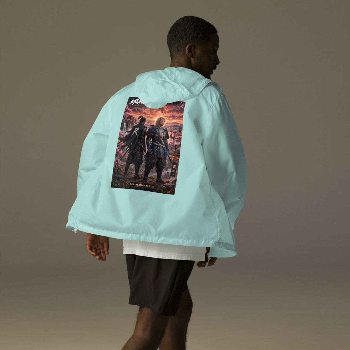 Sworn Brothers Ronin Windbreaker, aqua white zipper back: two warriors, a dark-haired ronin and a golden-haired samurai in blue armor, under a blood-red moon with a white $RONIN