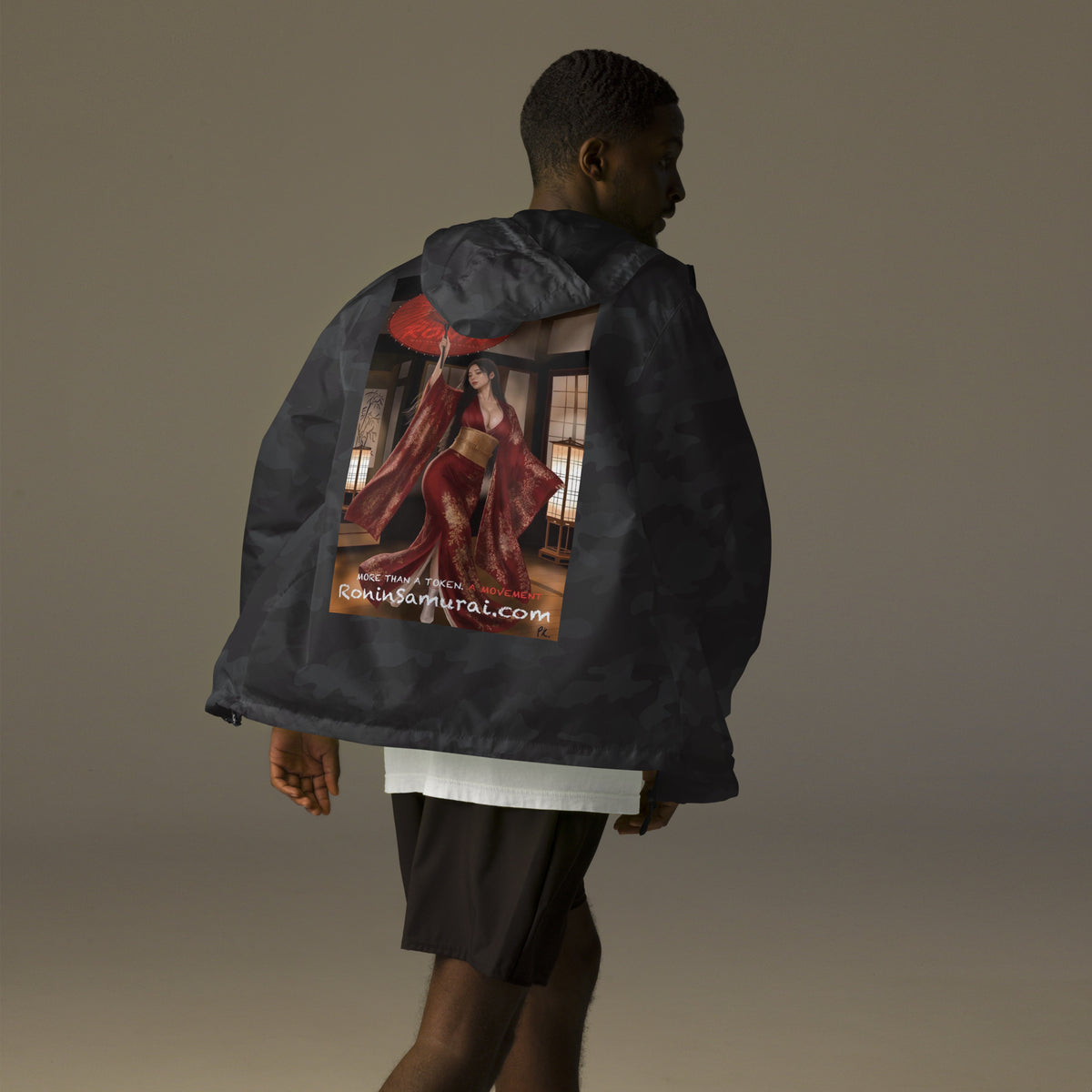 Red Parasol Ronin Windbreaker, black camo back: back print of a woman in a red kimono holding a red parasol in a shoji room