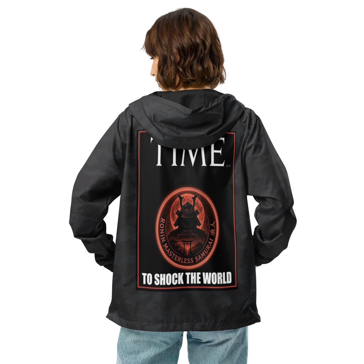 Ronin Cover Story Windbreaker, black camo back: back print of a red-framed cover-style poster with the round RONIN samurai seal and TO SHOCK THE WORLD