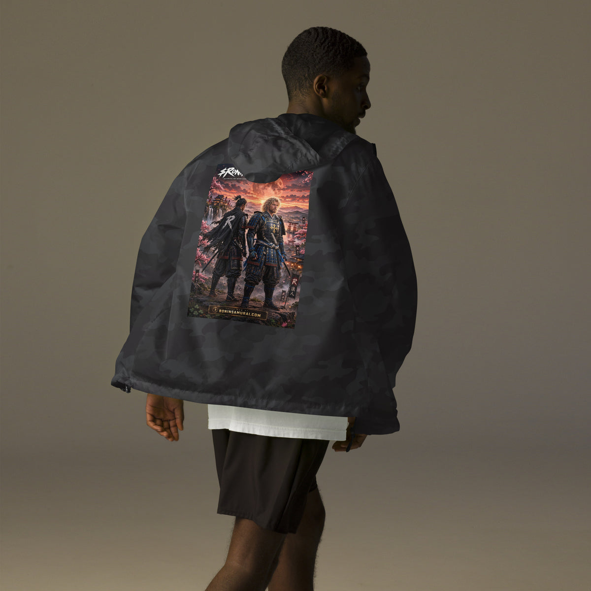 Sworn Brothers Ronin Windbreaker, black camo back: two warriors, a dark-haired ronin and a golden-haired samurai in blue armor, under a blood-red moon with a white $RONIN