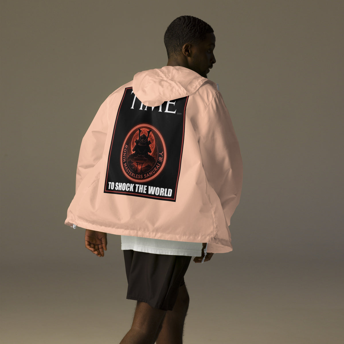 Ronin Cover Story Windbreaker, blush white zipper back: back print of a red-framed cover-style poster with the round RONIN samurai seal and TO SHOCK THE WORLD