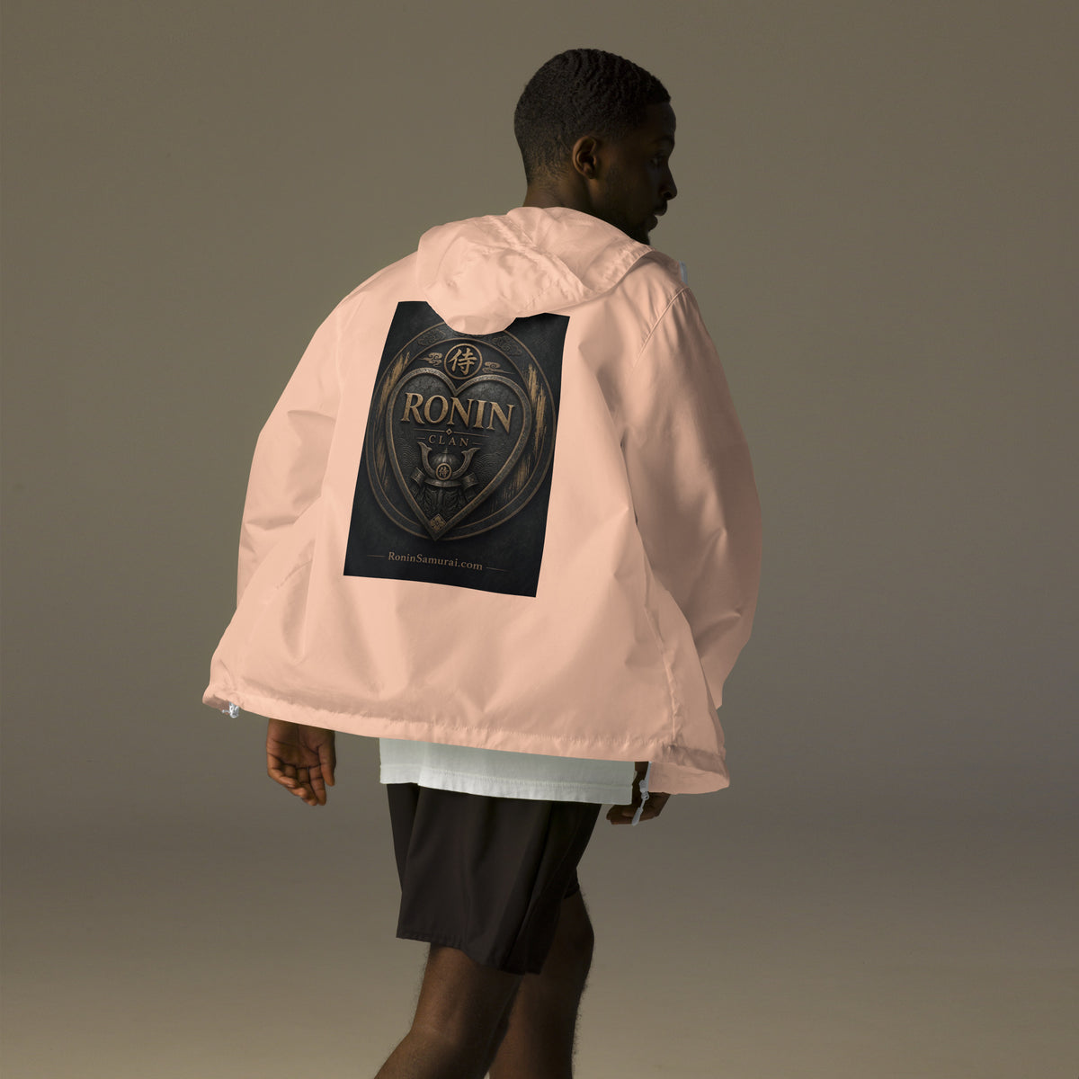 Bronze Crest Ronin Clan Windbreaker, blush white zipper back: bronze heart shield with the 侍 seal, RONIN CLAN and a kabuto emblem