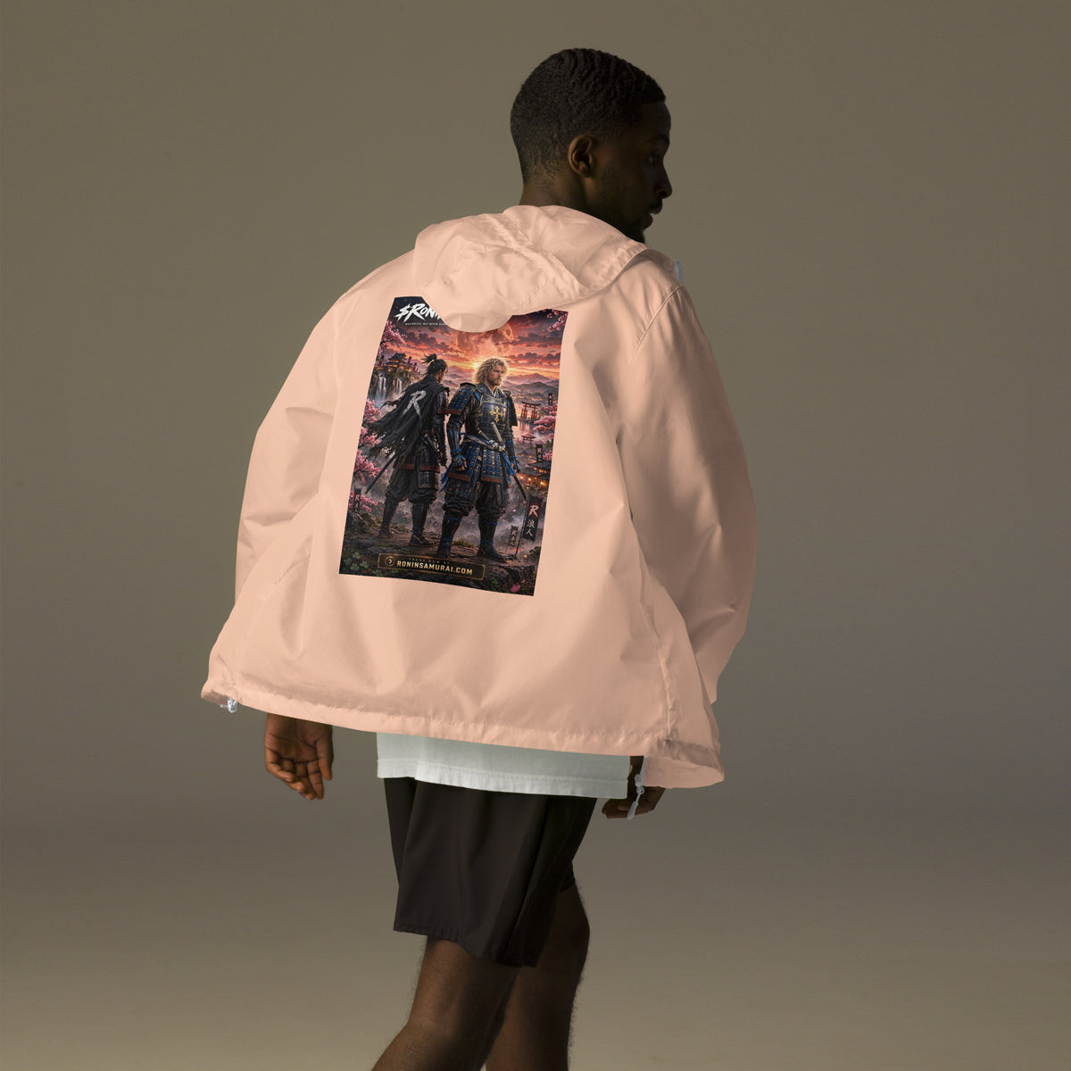 Sworn Brothers Ronin Windbreaker, blush white zipper back: two warriors, a dark-haired ronin and a golden-haired samurai in blue armor, under a blood-red moon with a white $RONIN