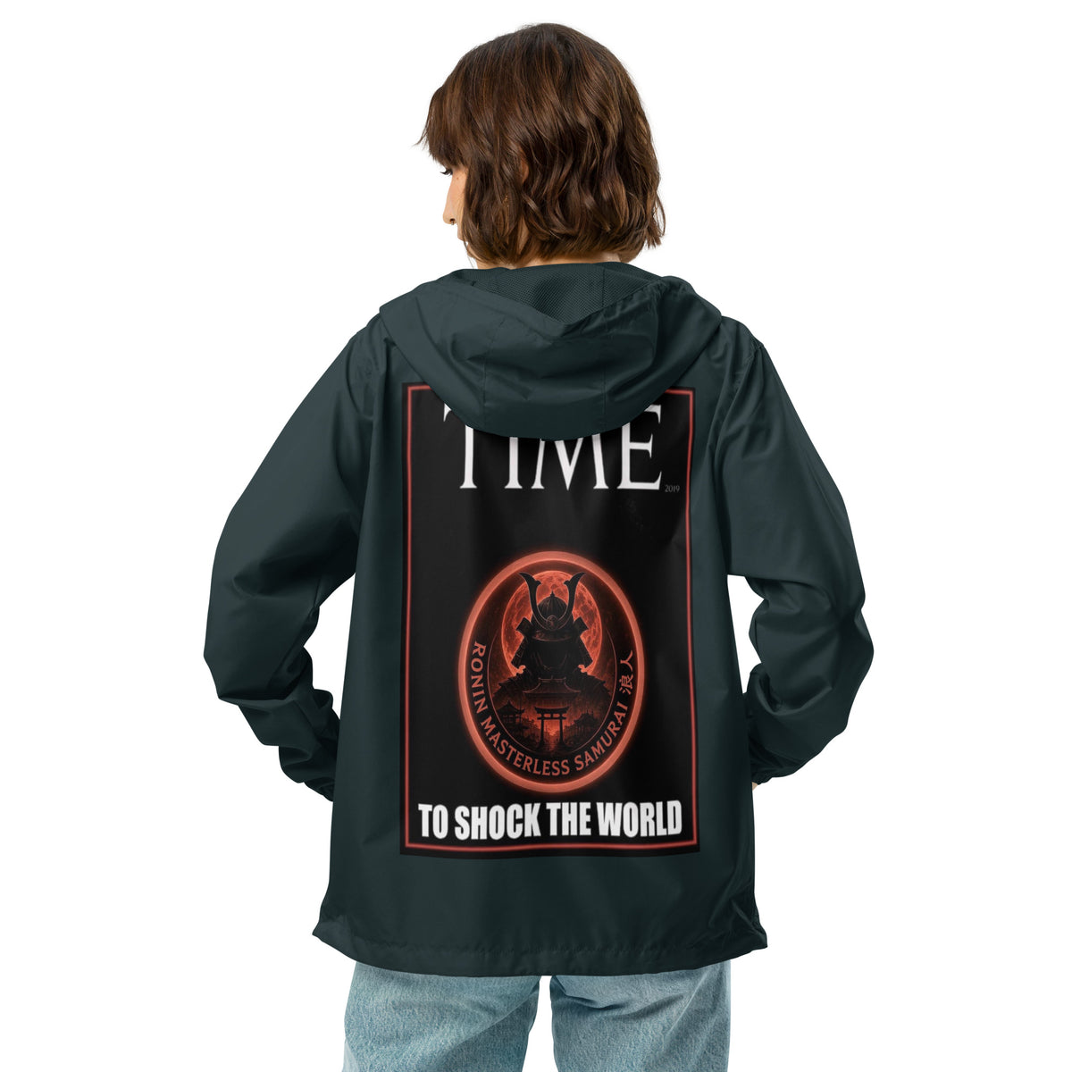 Ronin Cover Story Windbreaker, classic navy back: back print of a red-framed cover-style poster with the round RONIN samurai seal and TO SHOCK THE WORLD