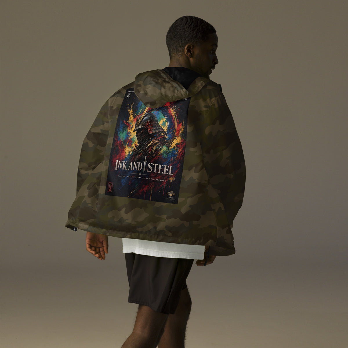 Ink and Steel Samurai Windbreaker, forest camo back: back print of a samurai in a gold-crested helmet amid paint splashes, INK AND STEEL