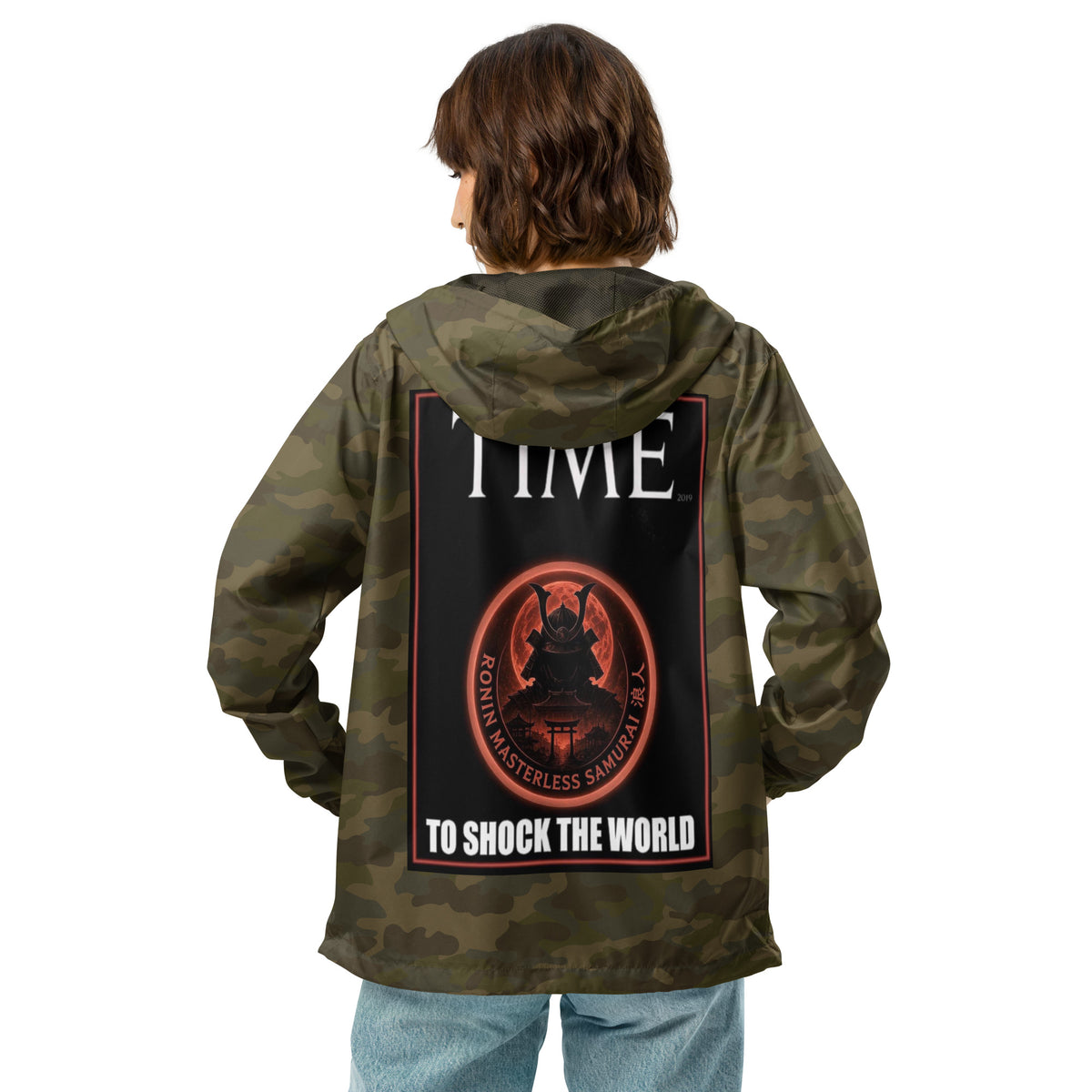 Ronin Cover Story Windbreaker, forest camo back: back print of a red-framed cover-style poster with the round RONIN samurai seal and TO SHOCK THE WORLD