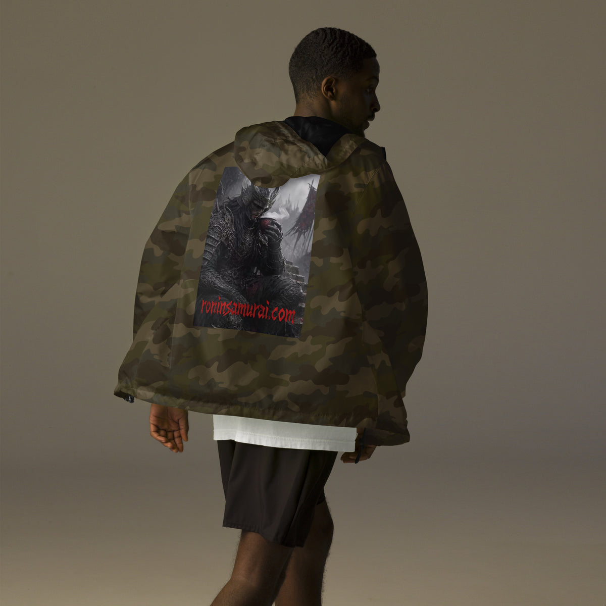 Warlord's Brew Windbreaker, forest camo back: back print of a dark horned armored warlord sipping a steaming cup