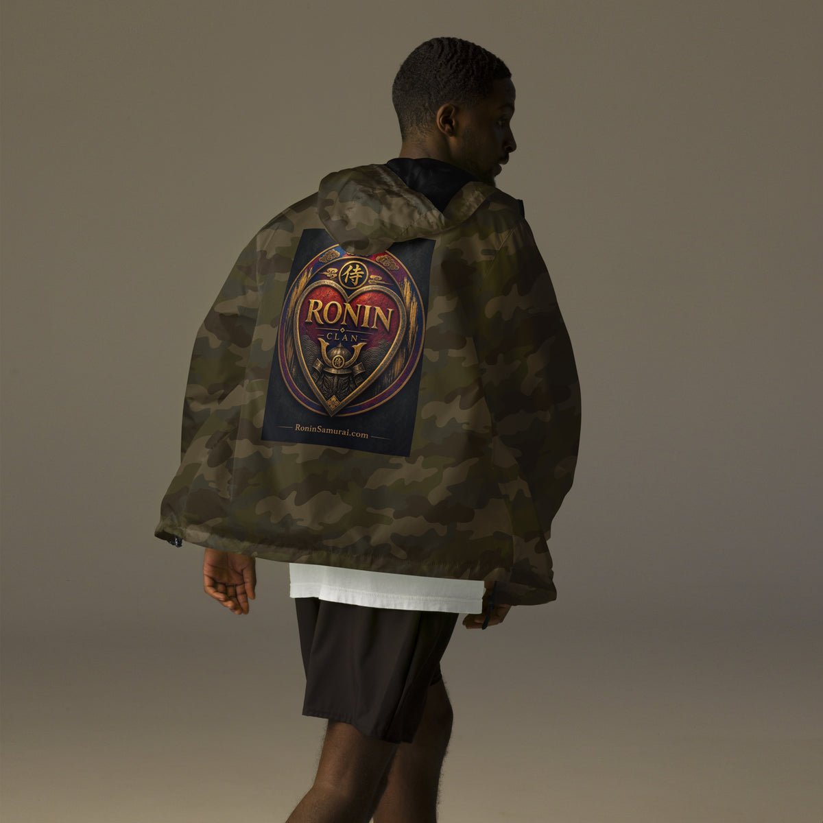 Royal Crest Ronin Clan Windbreaker, forest camo back: gilded red-and-gold heart shield with the 侍 seal, RONIN CLAN and kabuto emblem