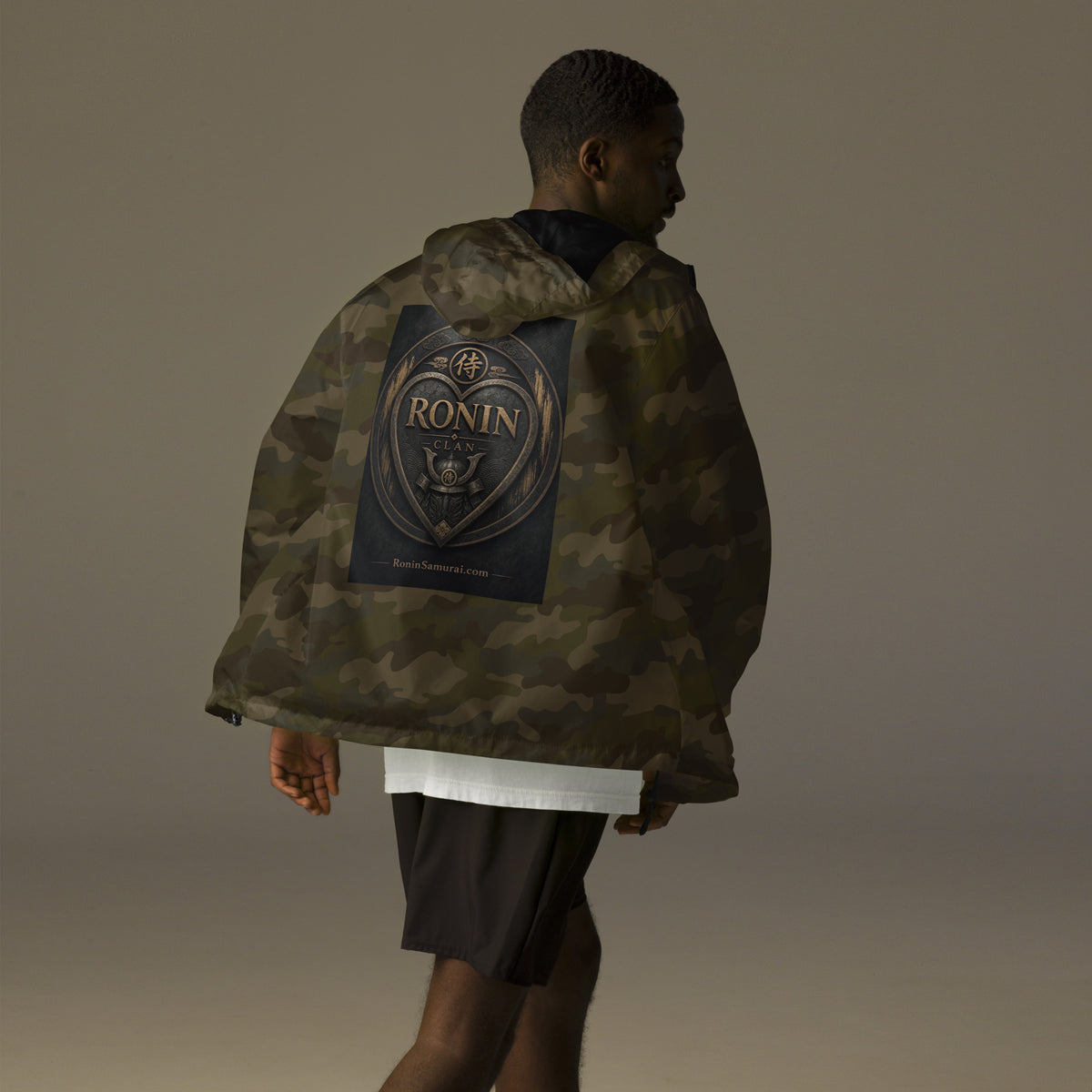 Bronze Crest Ronin Clan Windbreaker, forest camo back: bronze heart shield with the 侍 seal, RONIN CLAN and a kabuto emblem
