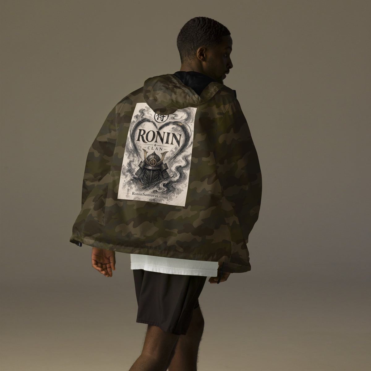 Ink Heart Ronin Clan Windbreaker, forest camo back: ink-wash heart around a kabuto helmet on cream paper, 侍 seal and RONIN CLAN