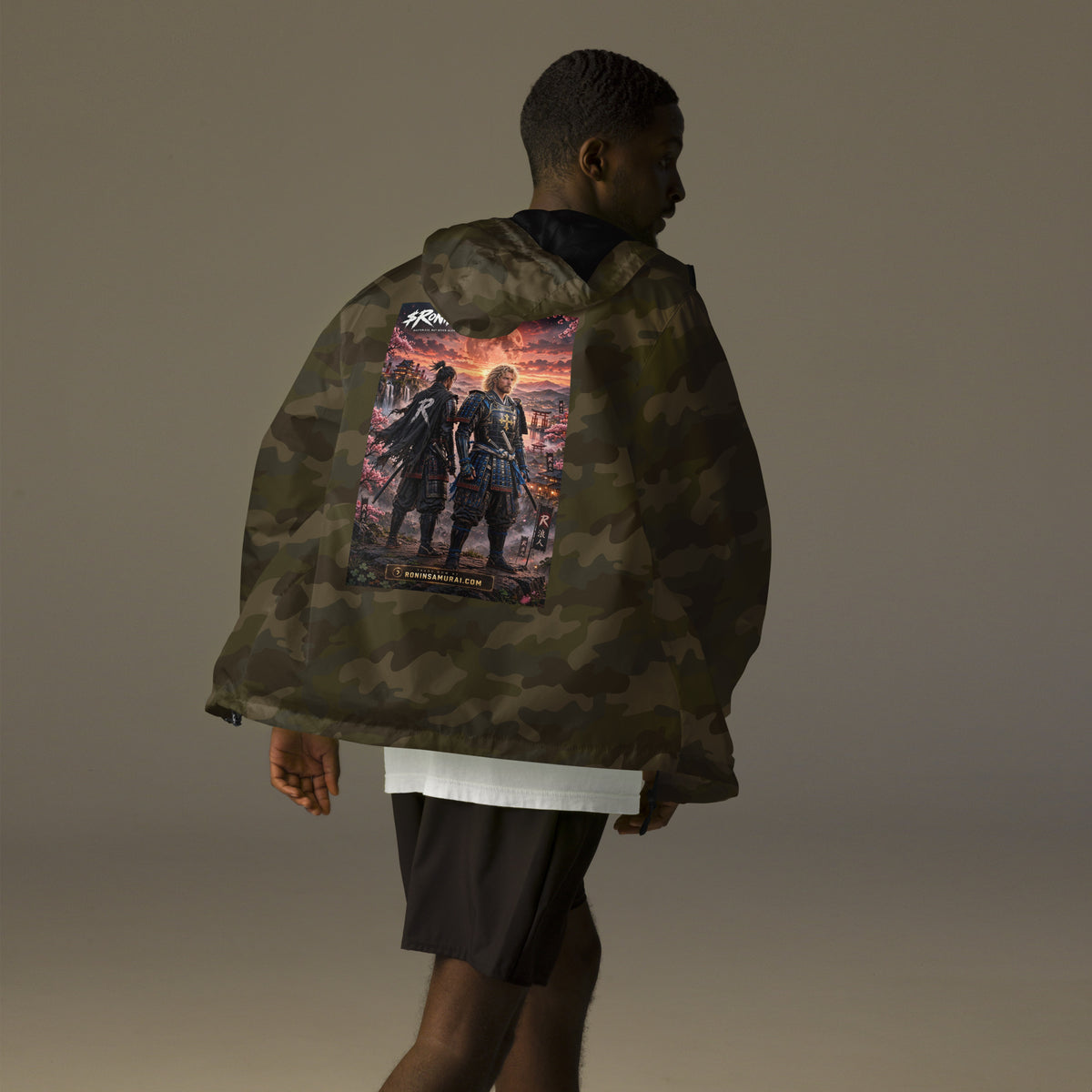 Sworn Brothers Ronin Windbreaker, forest camo back: two warriors, a dark-haired ronin and a golden-haired samurai in blue armor, under a blood-red moon with a white $RONIN