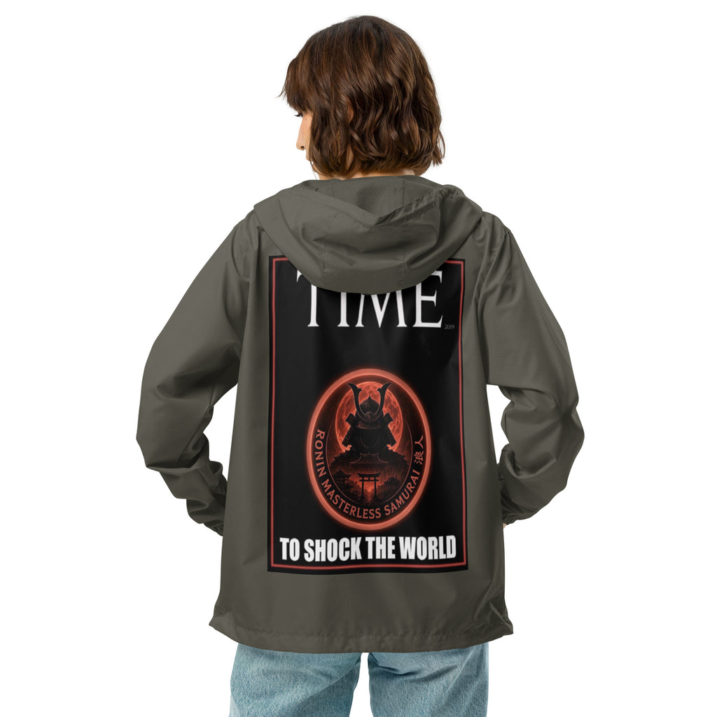 Ronin Cover Story Windbreaker, graphite back: back print of a red-framed cover-style poster with the round RONIN samurai seal and TO SHOCK THE WORLD