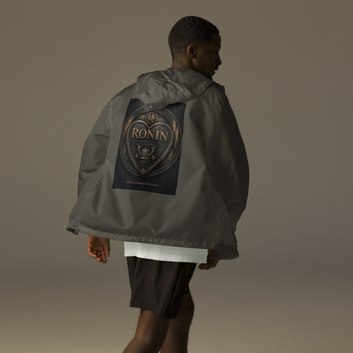 Bronze Crest Ronin Clan Windbreaker, graphite back: bronze heart shield with the 侍 seal, RONIN CLAN and a kabuto emblem