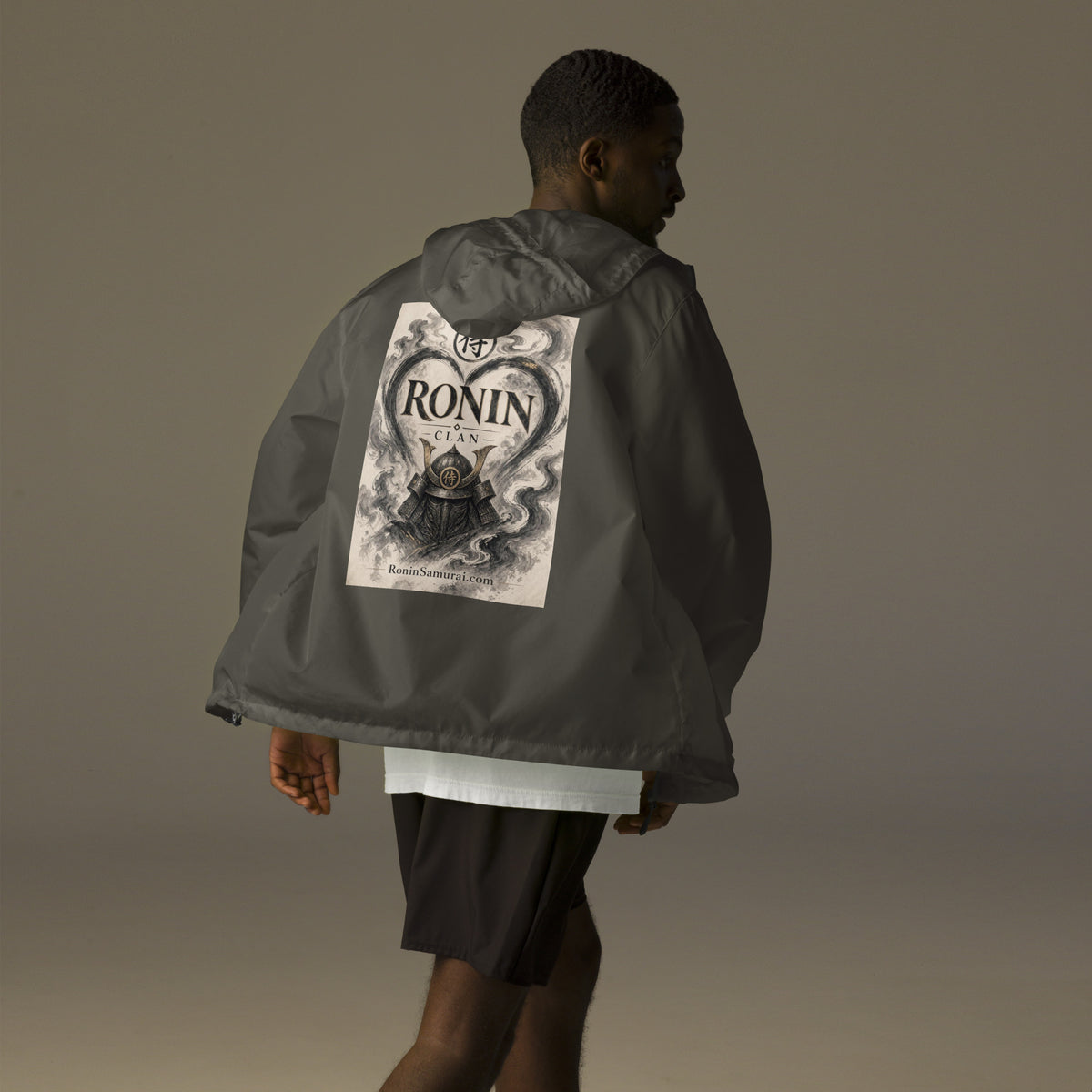 Ink Heart Ronin Clan Windbreaker, graphite back: ink-wash heart around a kabuto helmet on cream paper, 侍 seal and RONIN CLAN