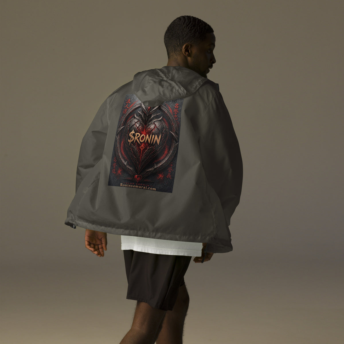 Obsidian Heart Ronin Windbreaker, graphite back: spiked black armored heart with a glowing red core and $RONIN, red kanji at the sides