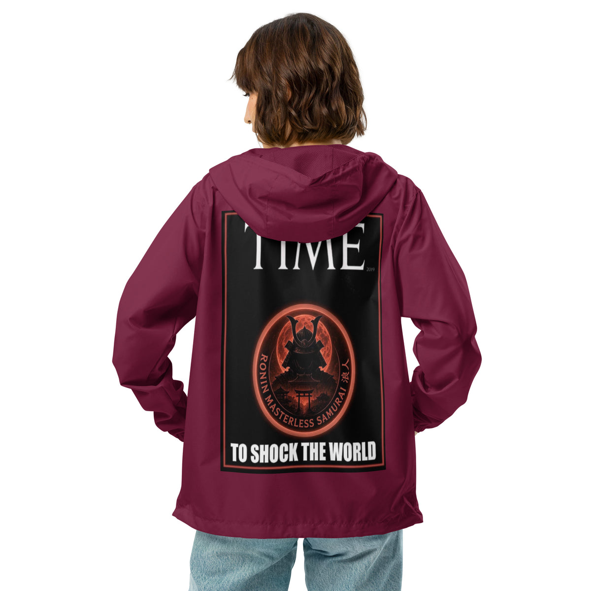 Ronin Cover Story Windbreaker, maroon back: back print of a red-framed cover-style poster with the round RONIN samurai seal and TO SHOCK THE WORLD