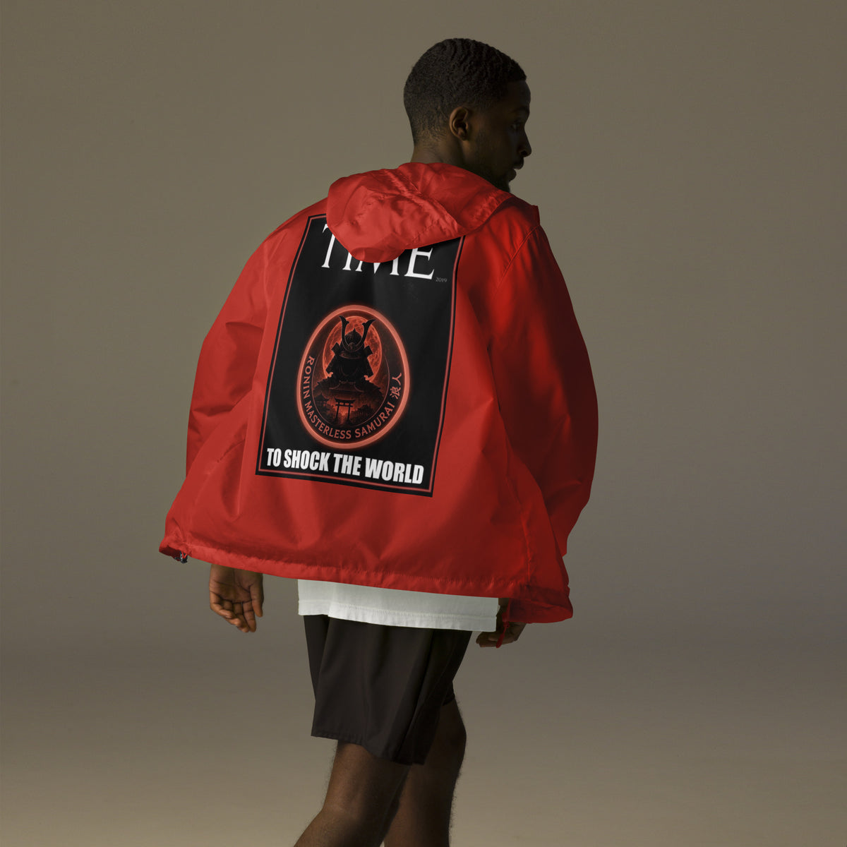 Ronin Cover Story Windbreaker, red back: back print of a red-framed cover-style poster with the round RONIN samurai seal and TO SHOCK THE WORLD